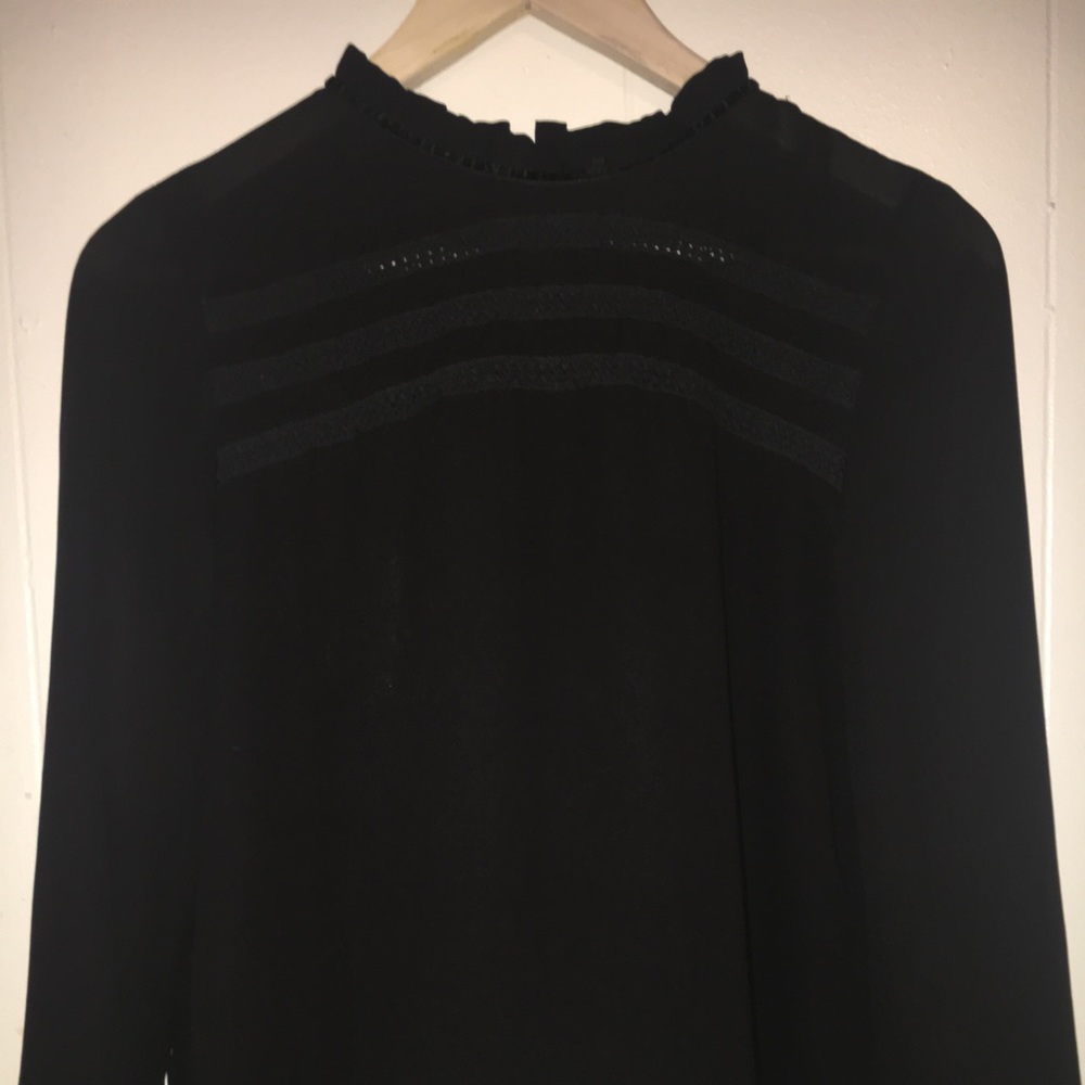 Black collared blouse.
